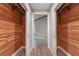 Hallway of cedar closets with shelving leading to a room with light gray walls at 4847 Lakewood Dr, Acworth, GA 30101