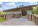 Back of house includes a wooden deck with easy access into the living room at 4847 Lakewood Dr, Acworth, GA 30101