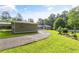 View of the property featuring a long driveway, green lawn and plenty of trees at 4847 Lakewood Dr, Acworth, GA 30101