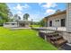 Exterior of home with well-manicured lawn, covered carport, and steps to the entrance at 4847 Lakewood Dr, Acworth, GA 30101