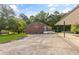 Exterior of home with a large paved driveway, a blend of brick and siding, and a covered carport at 4847 Lakewood Dr, Acworth, GA 30101