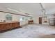 The large garage has built in storage, work benches, and bright lighting at 4847 Lakewood Dr, Acworth, GA 30101