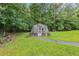 Backyard greenhouse surrounded by lush greenery at 4847 Lakewood Dr, Acworth, GA 30101