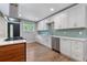 Beautiful kitchen with white cabinetry, stainless steel appliances, and a tile backsplash at 4847 Lakewood Dr, Acworth, GA 30101