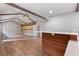 Spacious living area boasts an island with bar seating plus wooden beam and accent wall at 4847 Lakewood Dr, Acworth, GA 30101