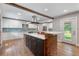 Modern kitchen featuring a center island with breakfast bar, stainless appliances, and bright countertops at 4847 Lakewood Dr, Acworth, GA 30101