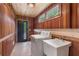 Unique wood paneled laundry room with washer, sink, and transom window at 4847 Lakewood Dr, Acworth, GA 30101