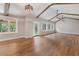 Bright and airy living room with wood floors, exposed beams, and plenty of natural light at 4847 Lakewood Dr, Acworth, GA 30101
