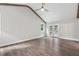 Large room with hardwood floors, a vaulted ceiling, and glass patio doors at 4847 Lakewood Dr, Acworth, GA 30101