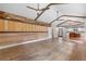Spacious living room featuring beautiful wood floors, ceiling fans, vaulted ceilings, and a unique accent wall at 4847 Lakewood Dr, Acworth, GA 30101