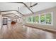 Spacious living room with wood floors, ceiling fans, and large windows at 4847 Lakewood Dr, Acworth, GA 30101