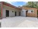 An expansive concrete patio featuring multiple entrances to the home at 4847 Lakewood Dr, Acworth, GA 30101