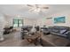Bright living room with wood-look floors, comfortable seating, and neutral decor at 6372 Valley Dale Dr, Riverdale, GA 30274