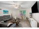 Inviting living room with modern furniture, neutral walls, and a ceiling fan at 6372 Valley Dale Dr, Riverdale, GA 30274