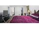 Bedroom features a TV, closet, and view of the ensuite bathroom at 6372 Valley Dale Dr, Riverdale, GA 30274