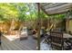 Private outdoor wooden deck with pergola, seating, and stone accents at 1192 Cleburne Ne Ave, Atlanta, GA 30307