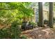 Secluded backyard with bench seating provides a tranquil setting to enjoy nature and the outdoors at 1192 Cleburne Ne Ave, Atlanta, GA 30307