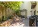 Outdoor patio with pergola, dining area, wood fencing, and lush greenery at 1192 Cleburne Ne Ave, Atlanta, GA 30307