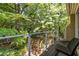 This balcony features tranquil views, stainless cable railing and room for chairs and a small table at 1192 Cleburne Ne Ave, Atlanta, GA 30307