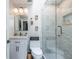 Contemporary bathroom boasts a glass-enclosed shower, sleek fixtures, and recessed lighting at 1192 Cleburne Ne Ave, Atlanta, GA 30307
