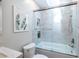 This bathroom features a tiled shower, marble counter, and built-in storage shelves at 1192 Cleburne Ne Ave, Atlanta, GA 30307