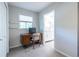 This bedroom is set up with a desk for work, and you can see the bathroom is through the door at 1192 Cleburne Ne Ave, Atlanta, GA 30307