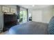 This modern bedroom features plush carpeting, neutral walls, and balcony access through sliding glass doors at 1192 Cleburne Ne Ave, Atlanta, GA 30307