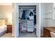 A glimpse inside this bedroom closet reveals ample storage with shelving for shoes and clothes at 1192 Cleburne Ne Ave, Atlanta, GA 30307