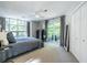 This bedroom has tons of natural light, a closet, and a balcony at 1192 Cleburne Ne Ave, Atlanta, GA 30307