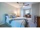 Bedroom featuring neutral tones, ceiling fan, desk, and ample closet space at 1192 Cleburne Ne Ave, Atlanta, GA 30307