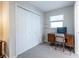 This bedroom is set up with a desk for work and a spacious closet for storage at 1192 Cleburne Ne Ave, Atlanta, GA 30307