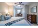 Bright bedroom with large bed, natural light, workspace, and modern ceiling fan at 1192 Cleburne Ne Ave, Atlanta, GA 30307