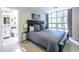 Bright bedroom boasts large window, and opens to en-suite bathroom featuring modern fixtures and ample natural light at 1192 Cleburne Ne Ave, Atlanta, GA 30307