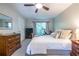 A bedroom features a large bed, TV, a stationary bike and natural light at 1192 Cleburne Ne Ave, Atlanta, GA 30307
