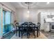 Elegant dining room with a modern light fixture, a large table, and access to the outdoor patio at 1192 Cleburne Ne Ave, Atlanta, GA 30307