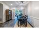 Bright dining room with backyard view and decorous cabinet adding storage and style at 1192 Cleburne Ne Ave, Atlanta, GA 30307