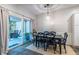 Cozy dining area with a large table, access to an outdoor patio, and stylish decor at 1192 Cleburne Ne Ave, Atlanta, GA 30307