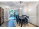 Bright dining room featuring a backyard view through sliding glass doors and a stylish hanging light fixture at 1192 Cleburne Ne Ave, Atlanta, GA 30307