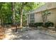 Inviting home exterior featuring a wall of windows, lush greenery and a gated entrance at 1192 Cleburne Ne Ave, Atlanta, GA 30307