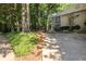 Stylish home with a modern facade, featuring a gated entrance and lush greenery enhancing its curb appeal at 1192 Cleburne Ne Ave, Atlanta, GA 30307
