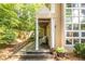 Charming home exterior featuring a covered porch, columns and mature landscaping at 1192 Cleburne Ne Ave, Atlanta, GA 30307