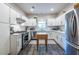 Bright kitchen featuring stainless steel appliances, white cabinets, and tile backsplash at 1192 Cleburne Ne Ave, Atlanta, GA 30307