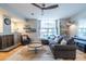 Inviting living area featuring hardwood floors, a cozy sofa, and a large window with ample natural light at 1192 Cleburne Ne Ave, Atlanta, GA 30307