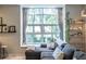 Bright and airy living room with large windows, plush seating, and stylish decor at 1192 Cleburne Ne Ave, Atlanta, GA 30307