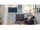 Cozy living room showcasing a brick fireplace, built-in shelves, and a comfortable leather chair at 1192 Cleburne Ne Ave, Atlanta, GA 30307