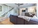 Spacious living room featuring hardwood floors, a staircase, and comfortable seating arrangement at 1192 Cleburne Ne Ave, Atlanta, GA 30307