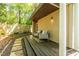 Covered patio with comfortable seating and a peaceful view of the backyard at 1192 Cleburne Ne Ave, Atlanta, GA 30307