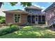 Expansive backyard with a screened-in porch and access to upper level via backyard steps at 2160 Kensington Gates Nw Dr, Kennesaw, GA 30152