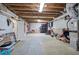 Unfinished basement with exposed ductwork and wooden ceiling and ample storage space at 2160 Kensington Gates Nw Dr, Kennesaw, GA 30152