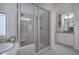 Bathroom with a large glass shower, jacuzzi tub, vanity, and great natural light at 2160 Kensington Gates Nw Dr, Kennesaw, GA 30152
